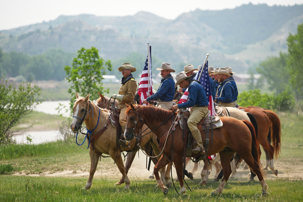 Roughrider reenactors wait for President Donald Trump's arrival at the opening of the Theodore Roosevelt Presidential Library, Wednesday, July 1, 2026, in Medora, N.D. (AP Photo/Matt Rourke)