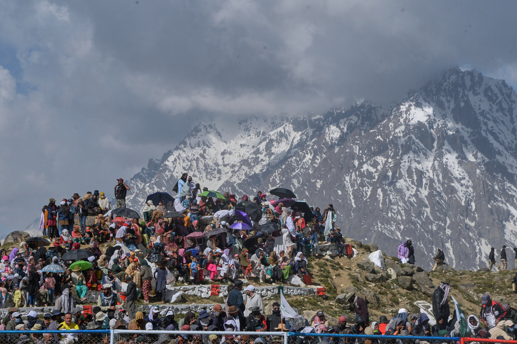 Spectators wait for start of the final polo match between Chitral region team and Gilgit-Baltistan region team during the three-day annual Shandur Polo Festival in Shandur Pass, in the Ghizer district of Gilgit-Baltistan, northern Pakistan, Saturday, June 13, 2026. (AP Photo/Zubair Abbasi)