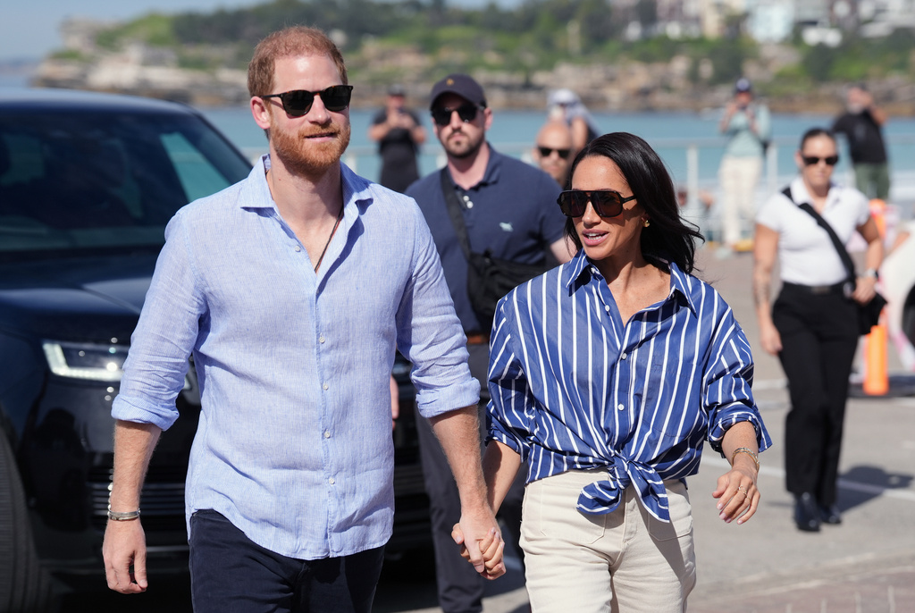 FILE - Prince Harry, and Meghan, the Duke and Duchess of Sussex, arrive for an event, during a visit to Bondi Beach, Australia, April 17, 2026. (Jonathan Brady/Pool Photo via AP, File)