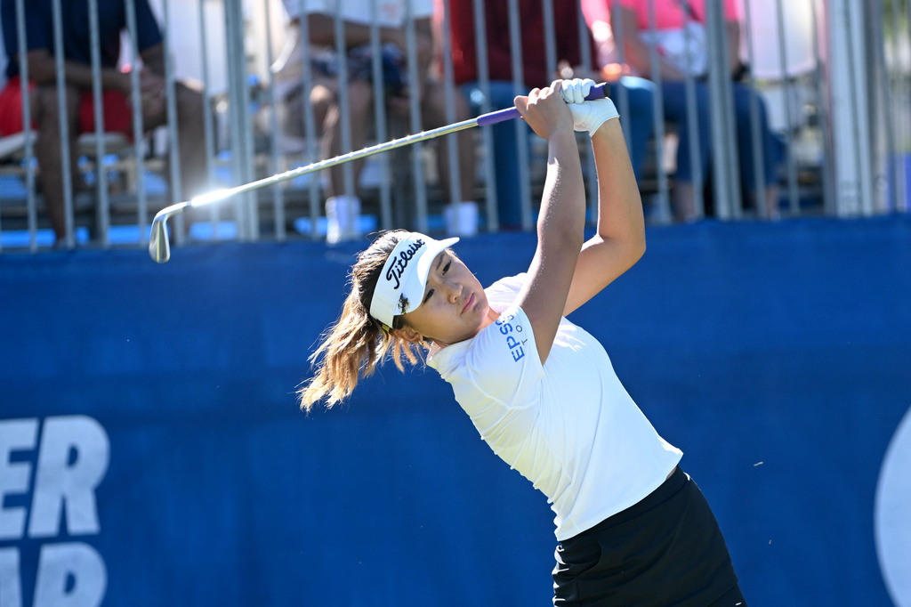 Michelle Zhang, of China, tees off on the 17th hole during the final round of the LPGA Walmart NW Arkansas Championship golf tournament, Sunday, Sept. 27, 2026, in Rogers, Ark. (AP Photo/Michael Woods)