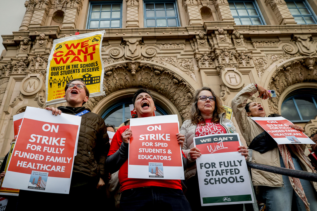 Math teacher Mar Martinez, center, joins teachers and San Francisco Unified School District staff join a city-wide protest to demand a fair contract while at Mission High School, Monday, Feb. 9, 2026, in San Francisco. (Brontë Wittpenn/San Francisco Chronicle via AP)