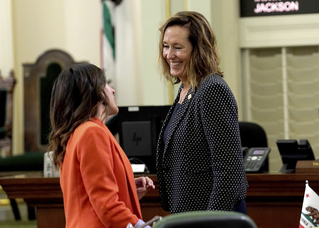 Democratic Assemblymembers Cottie Petrie-Norris, and Jacqui Irwin confer at the Capitol, in Sacramento, Calif. Thursday, Sept. 11, 2025. (AP Photo/Rich Pedroncelli)