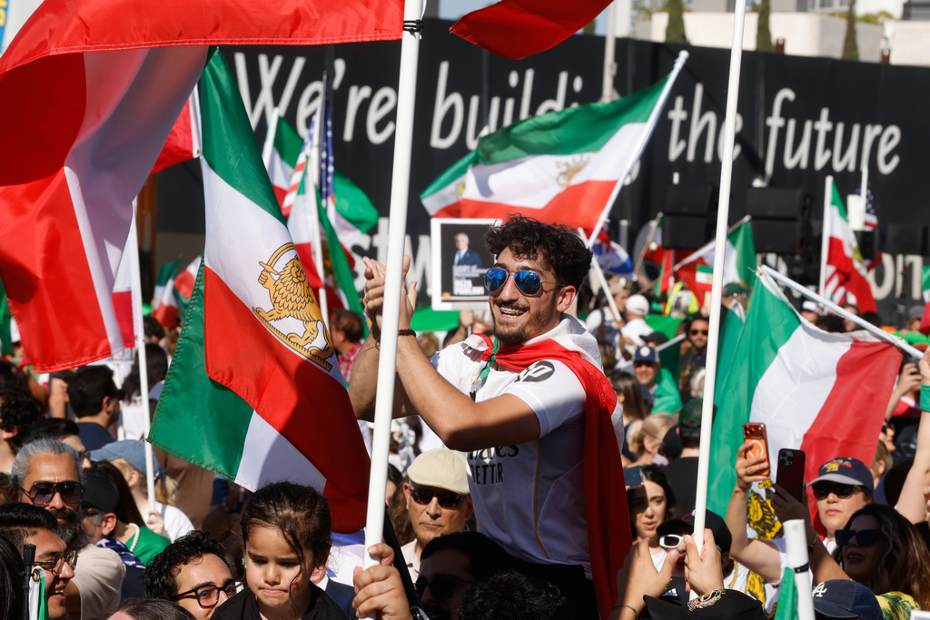 People chat slogans during a demonstration in support of the U.S. and Israeli strikes on Iran on Sunday, March 1, 2026, in Los Angeles. (AP Photo/Jill Connelly)