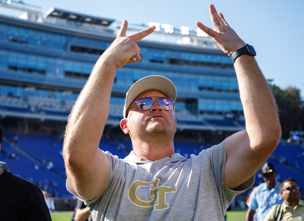 Georgia Tech head coach Brent Key gestures to fans after defeating Duke in an NCAA college football game in Durham, N.C., Saturday, Oct. 18, 2025. (AP Photo/Ben McKeown)
