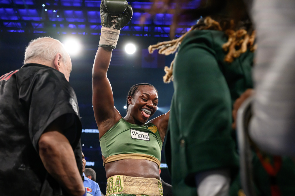 Claressa Shields celebrates her win over Franchon Crews-Dezurn in their Undisputed Heavyweight World Championship boxing match, Sunday, Feb. 22, 2026, in Detroit. (AP Photo/Lon Horwedel)