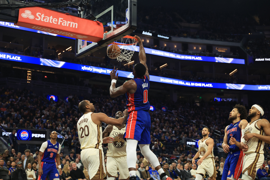 Detroit Pistons center Jalen Duren (0) dunks against Golden State Warriors center Al Horford (20) during the first half of an NBA basketball game in San Francisco, Friday, Jan. 30, 2026. (AP Photo/Jed Jacobsohn)