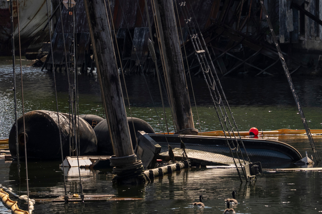 Debris of the Victory Chimes and the Pilot floats in the Henry Street Basin, Wednesday, Aug. 26, 2026, in the Brooklyn borough of New York. (AP Photo/Yuki Iwamura)