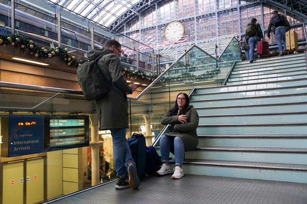 Travellers wait for Eurostar services at St Pancras International station in London, Tuesday, Dec. 30, 2025. (AP Photo/Alberto Pezzali)