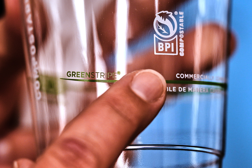 The BPI logo is displayed on a cup made from bioplastic pellets, which is certified by the Biodegradable Products Institute as compostable, at CJ Biomaterials, Monday, Aug. 3, 2026, in Woburn, Mass. (AP Photo/Charles Krupa)