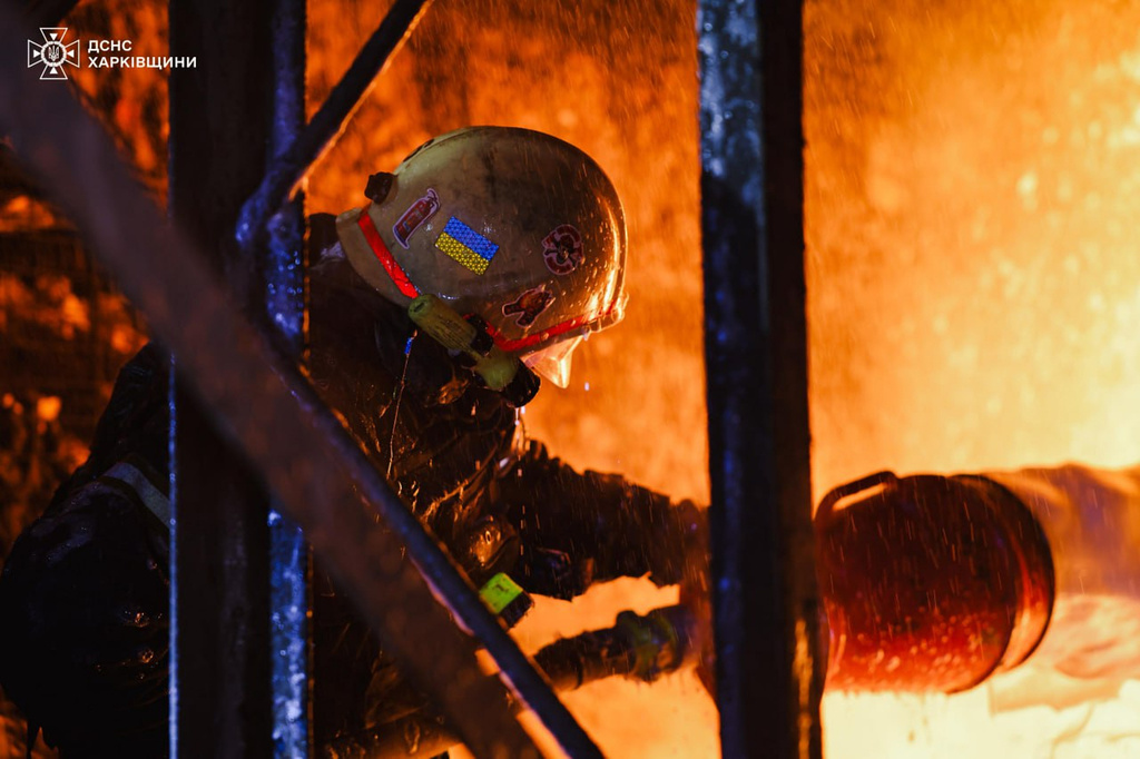 In this photo provided by the Ukrainian Emergency Service, firefighters put out the fire following a Russian drones attack in Kharkiv, Ukraine, Wednesday, Sept. 24, 2025. (Ukrainian Emergency Service via AP)
