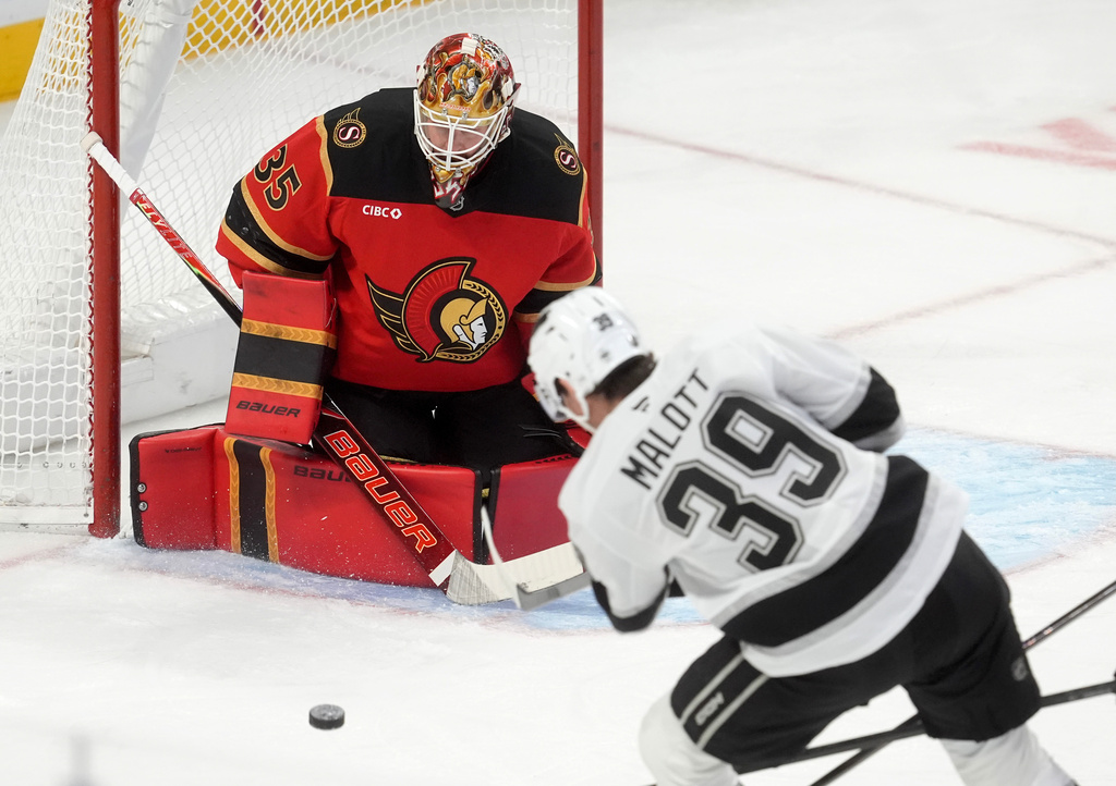 Los Angeles Kings left wing Jeff Malott (39) shoots the puck on Ottawa Senators goaltender Linus Ullmark (35) during second period NHL action in Ottawa, Saturday, Nov. 15, 2025. (Adrian Wyld/The Canadian Press via AP)