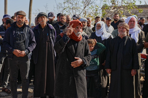 An elderly man speaks during the funeral of two women and a man killed when gunmen on motorcycles fired on a van near the Druze village of Kafr Maris, Syria's Idlib province, Wednesday, Oct. 22, 2025. (AP Photo/Omar Albam) An elderly man speaks during the funeral of two women and a man killed when gunmen on motorcycles fired on a van near the Druze village of Kafr Maris, Syria's Idlib province, Wednesday, Oct. 22, 2025. (AP Photo/Omar Albam)