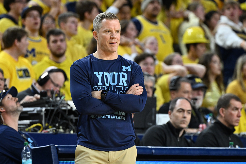 Michigan head coach Dusty May watches his team play Nebraska in the first half of an NCAA college basketball game in Ann Arbor, Mich., Tuesday, Jan. 27, 2026. (AP Photo/Lon Horwedel)