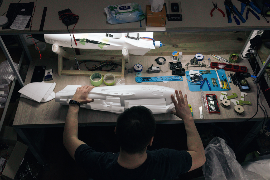 A soldier of the 127th Separate Territorial Brigade mounts a drone at a workshop on the front line in the Kharkiv region Friday, March 13, 2026. (AP Photo/Nikoletta Stoyanova)