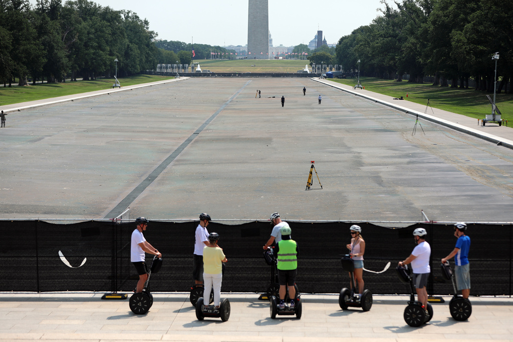 The Reflecting Pool, Washington Monument and U.S. Capitol are seen, Wednesday, July 15, 2026, in Washington. (AP Photo/Rahmat Gul)