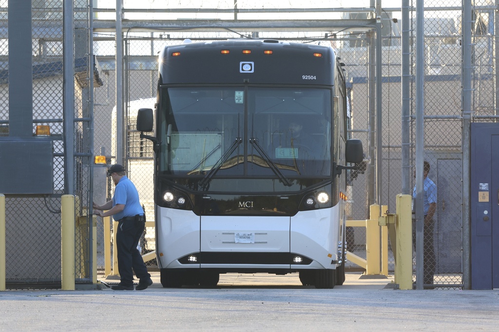 A bus leave the Folkston Immigration and Customs Enforcement processing center, Wednesday, Sept. 10, 2025, in Folkston, Ga. (AP Photo/Gary McCullough)