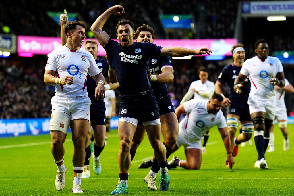 Scotland's Ben White celebrates scoring a try during the Six Nations rugby union match between Scotland and England in Edinburgh, Scotland, Saturday Feb. 14, 2026. (Jane Barlow/PA via AP)