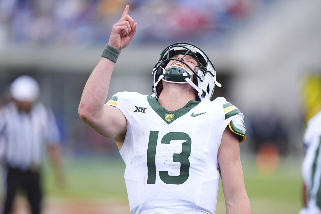 Baylor quarterback Sawyer Robertson (13) reacts to throwing a touchdown pass during the second half of an NCAA college football game against SMU Saturday, Sept. 6, 2025, in Dallas. (AP Photo/LM Otero)