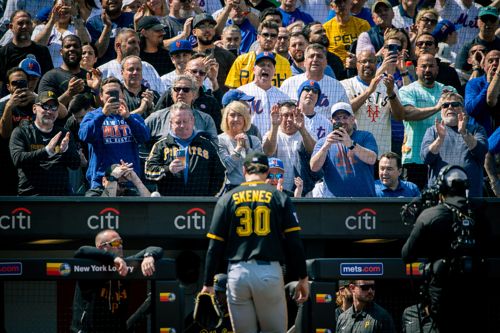 The crowd cheers and jeers as Pittsburgh Pirates pitcher Paul Skenes (30) exits the field after he was relieved in the first inning of an opening-day baseball game against the New York Mets, Thursday, March 26, 2026, in New York. (AP Photo/Angelina Katsanis)