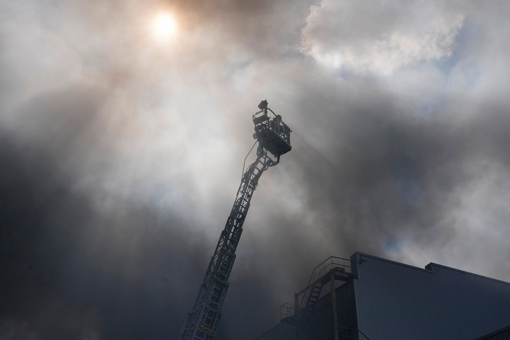 Firefighters put out a fire at warehouse stores after a Russian air attack in Kyiv, Ukraine, Wednesday, Sept. 2, 2026. (AP Photo/Efrem Lukatsky)