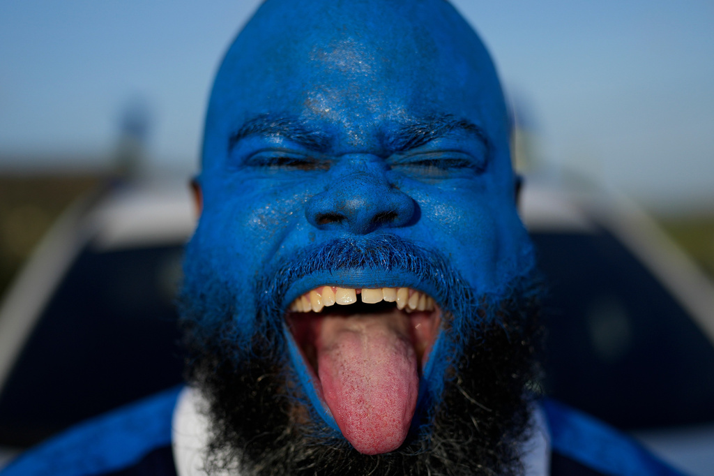 Brenton Balentien, known as Blue Face, a leader of supporters of Curacao’s national soccer team, poses wearing face paint in the team’s colors in Willemstad, Curacao, Saturday, May 16, 2026. (AP Photo/Matias Delacroix)