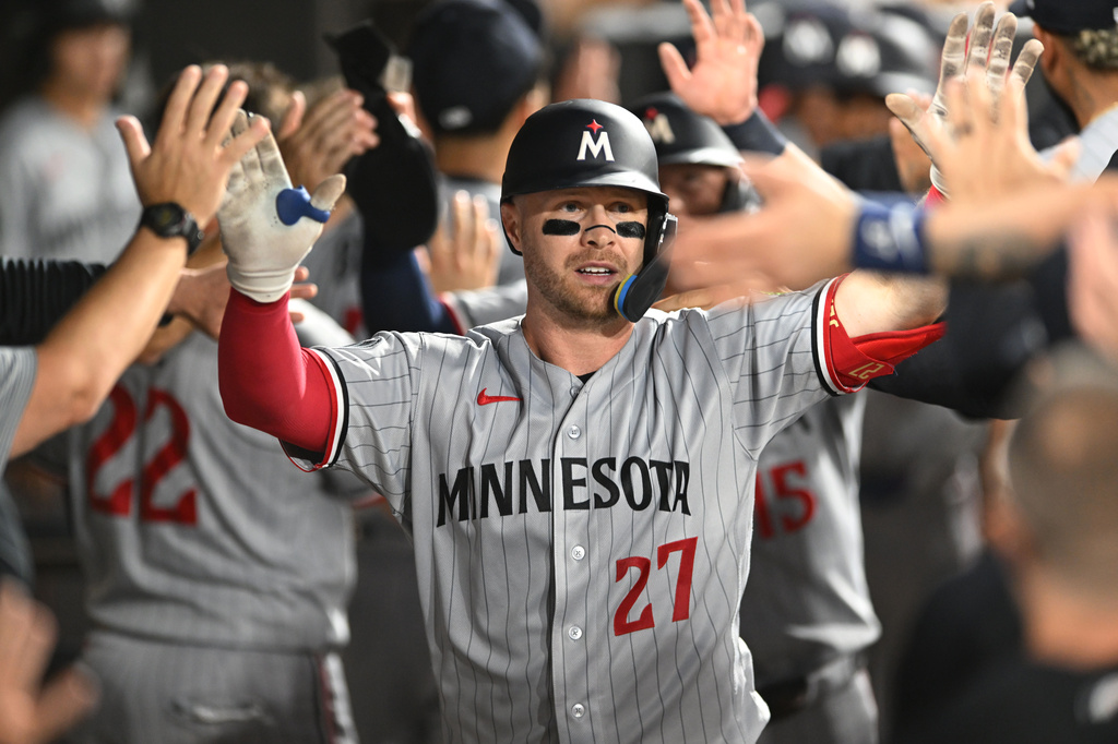 Minnesota Twins' Ryan Jeffers (27) celebrates with teammates in the dugout after hitting a three-run home run during the fifth inning of a baseball game against the Chicago White Sox Saturday, Sept. 5, 2026, in Chicago. (AP Photo/Paul Beaty)