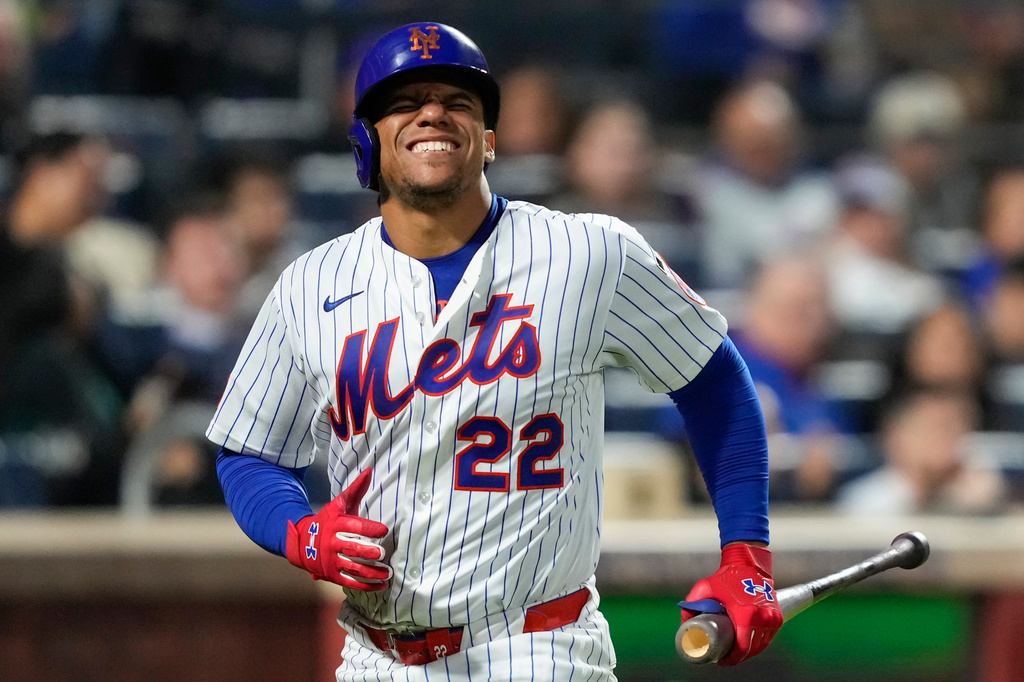 New York Mets designated hitter Juan Soto reacts after getting hit by the ball on his ankle during the third inning of a baseball game against the Detroit Tigers, Wednesday, May 13, 2026, in New York. (AP Photo/Yuki Iwamura)