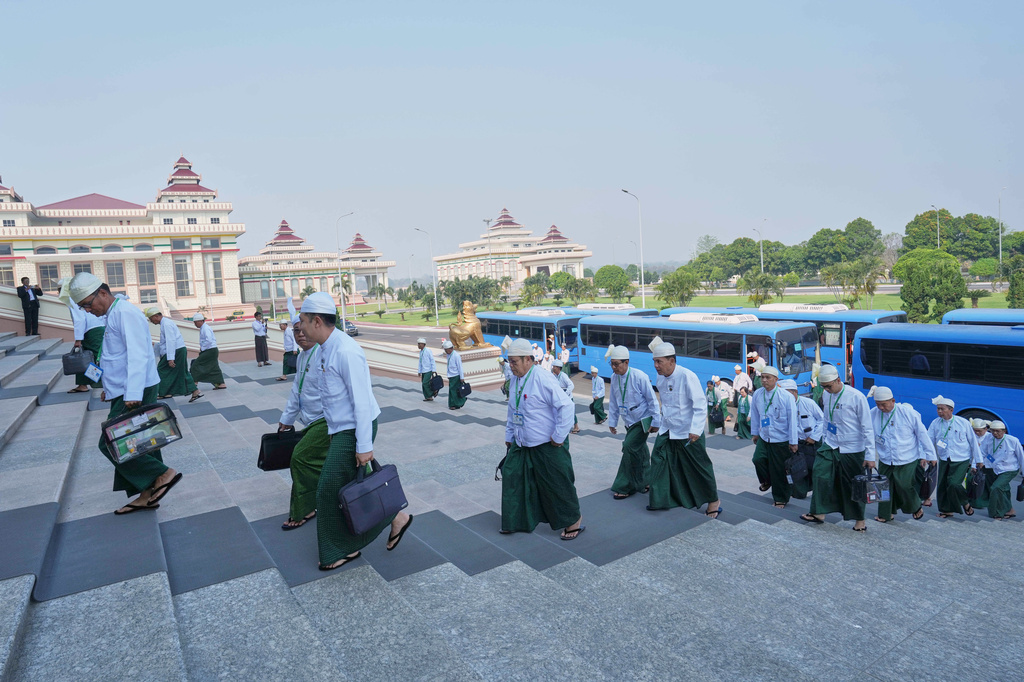 Myanmar lawmakers arrive to attend a session at Lower House of Parliament in Naypyitaw, Myanmar, Monday, March 30, 2026. (AP Photo/Aung Shine Oo)