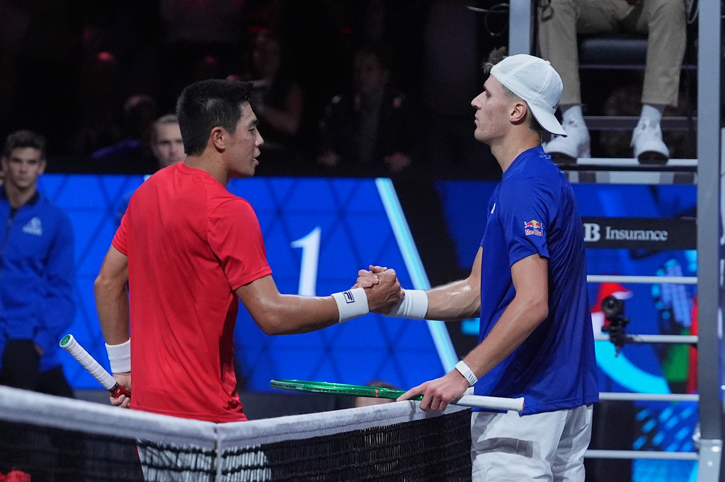 Team World's Brandon Nakashima, left, shakes hands with Team Europe's Jakub Mensik after winning a Laver Cup tennis tournament match in London, Friday, Sept. 25, 2026. (AP Photo/Maja Smiejkowska)