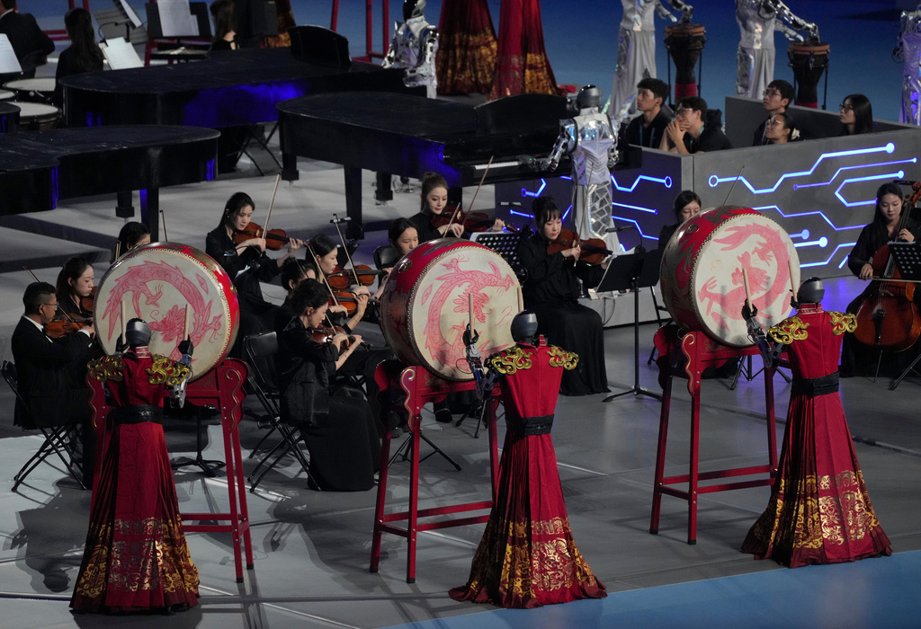 Robots perform with drum during the opening ceremony of the World Humanoid Robot Games in Beijing, Saturday, Aug. 22, 2026. (AP Photo/Achmad Ibrahim)