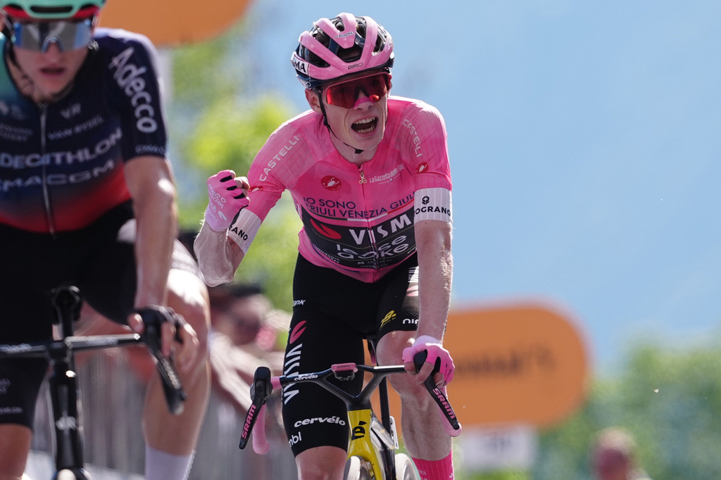 The pink jersey Denmark's Jonas Vingegaard Hansen of Team Visma | Lease A Bike reacts as he finishes the 19th stage of the Giro d'Italia cycling race, from Feltre to Alleghe, Italy, Friday, May 29, 2026. (Gian Mattia D'Alberto/LaPresse via AP)