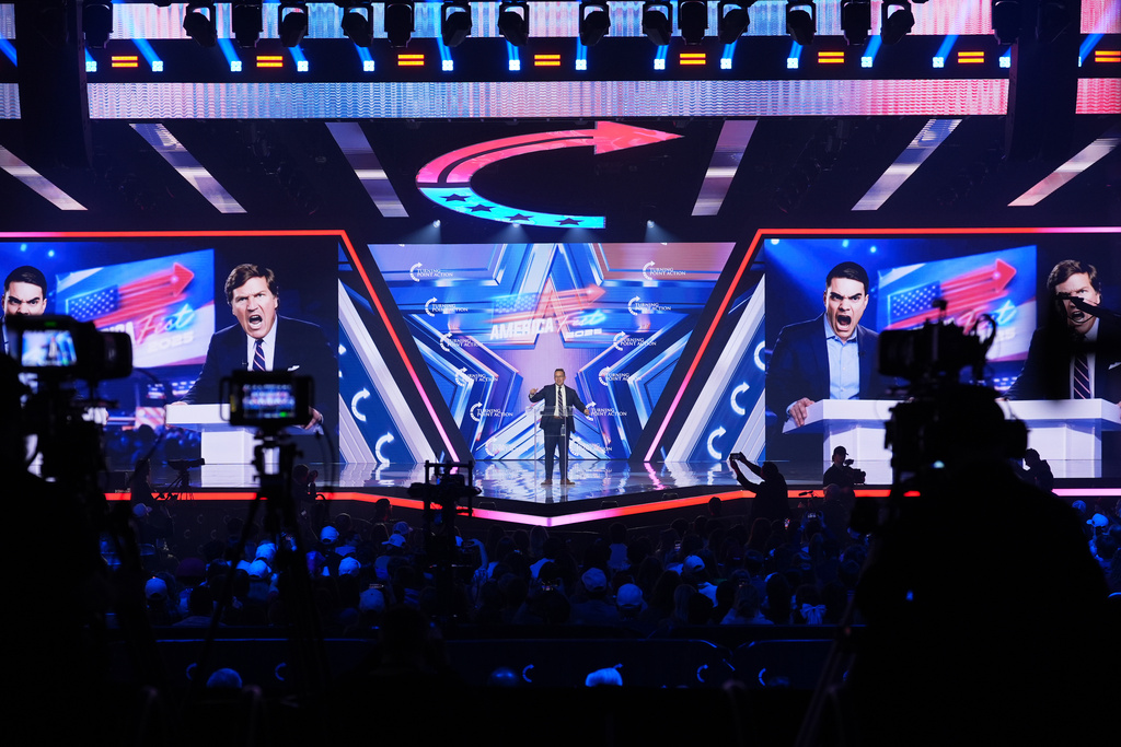 Benny Johnson speaks during Turning Point USA's AmericaFest 2025, Saturday, Dec. 20, 2025, in Phoenix. (AP Photo/Ross D. Franklin)