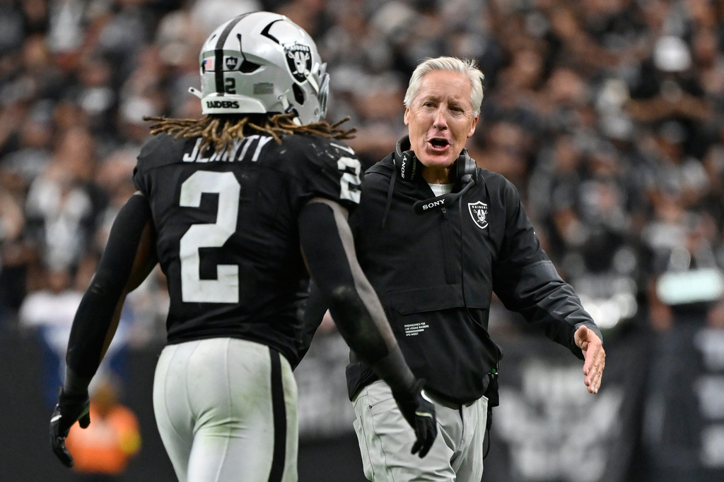 Las Vegas Raiders head coach Pete Carroll celebrates after Las Vegas Raiders running back Ashton Jeanty (2) scored a touchdown against the Tennessee Titans during the second half of an NFL football game, Sunday, Oct. 12, 2025, in Las Vegas. (AP Photo/David Becker)