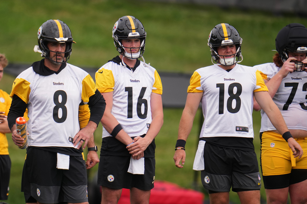 Pittsburgh Steelers quarterbacks Aaron Rodgers (8), Drew Allar (16), and Will Howard (18) wait their turn during the NFL team's camp in Latrobe, Pa., Saturday, Aug. 1, 2026. (AP Photo/Gene J. Puskar)