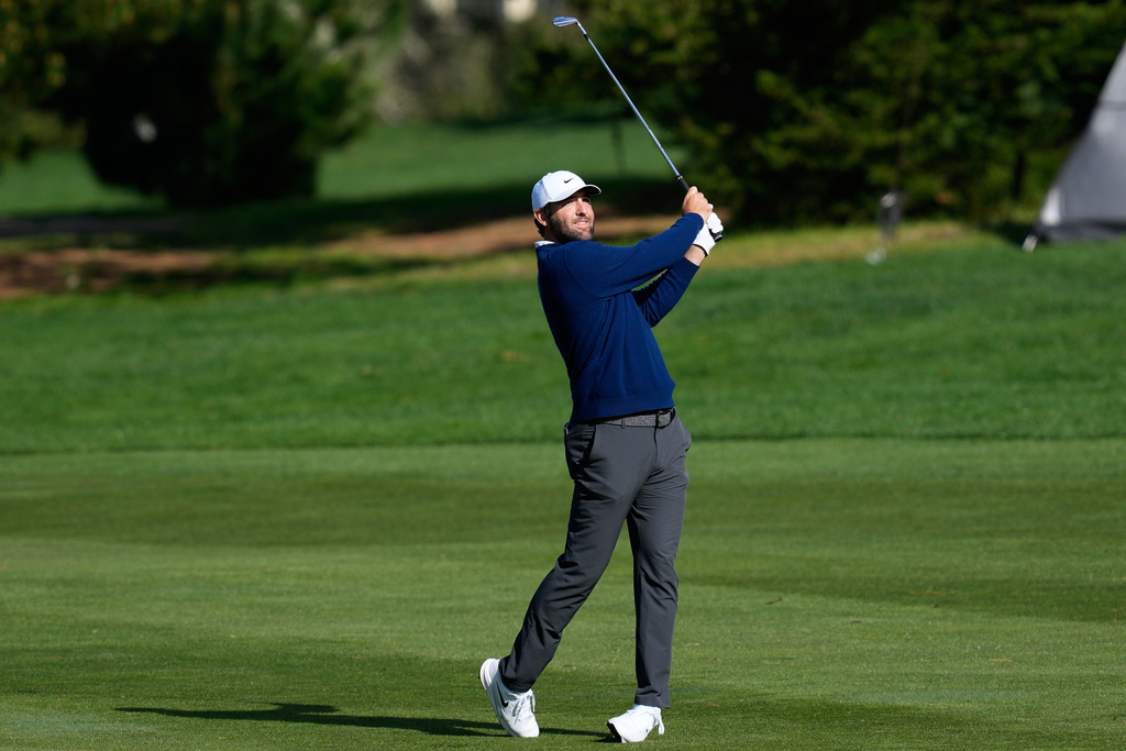Scottie Scheffler hits from the ninth fairway at Spyglass Hill Golf Course during the second round of the AT&T Pebble Beach Pro-Am golf tournament in Pebble Beach, Calif., Friday, Feb. 13, 2026. (AP Photo/Godofredo A. Vásquez)