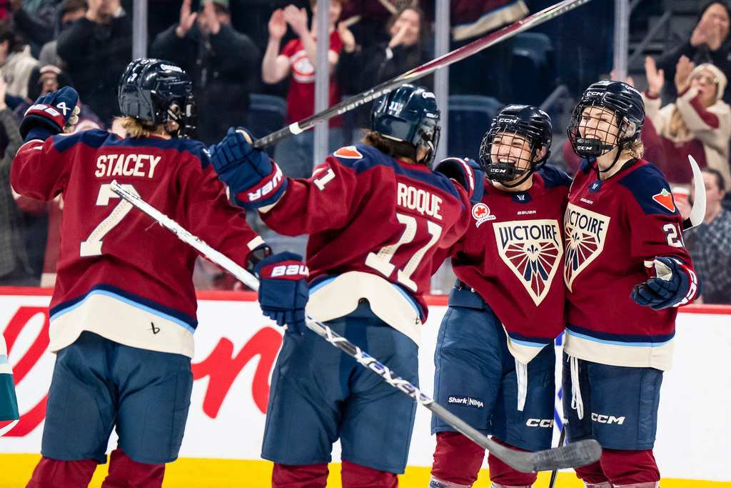 Montreal Victoire's Catherine Dubois (28), far right, celebrates with teammates after scoring during second period PWHL hockey action against Seattle Torrent in Laval, Que., on Thursday, March 19, 2026. (Christopher Katsarov/The Canadian Press via AP)