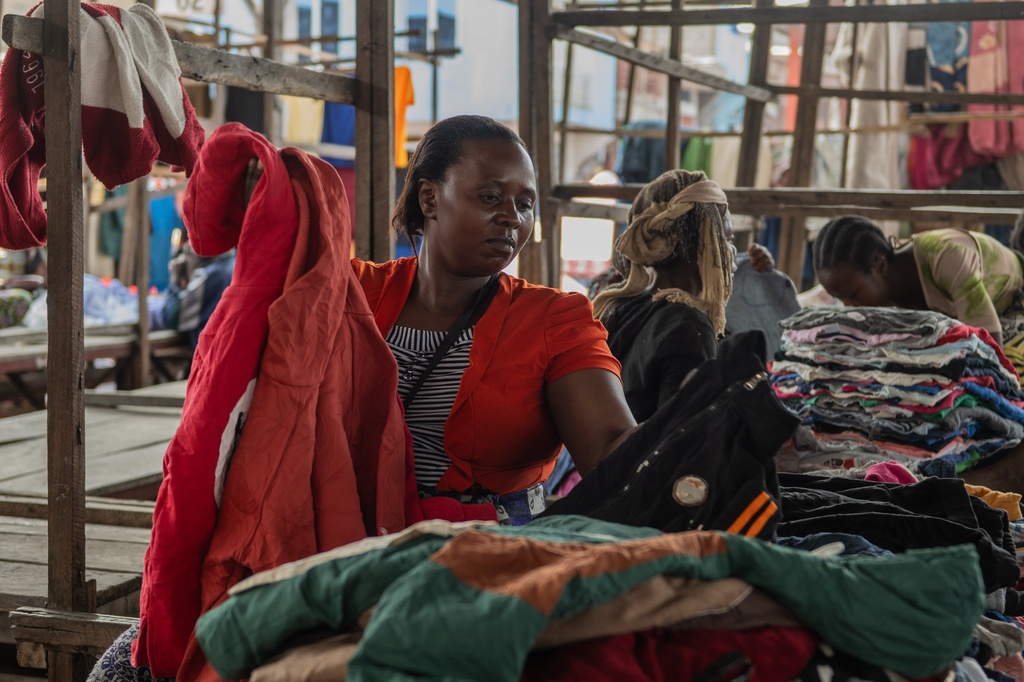 Justine Bunyere, mother of nine children, sells her goods at the Kituku market on the shores of Lake Kivu in Goma, Democratic Republic of the Congo, Monday, Jan. 26, 2026, a year after M23 took control of the city. (AP Photo/Moses Sawasawa)