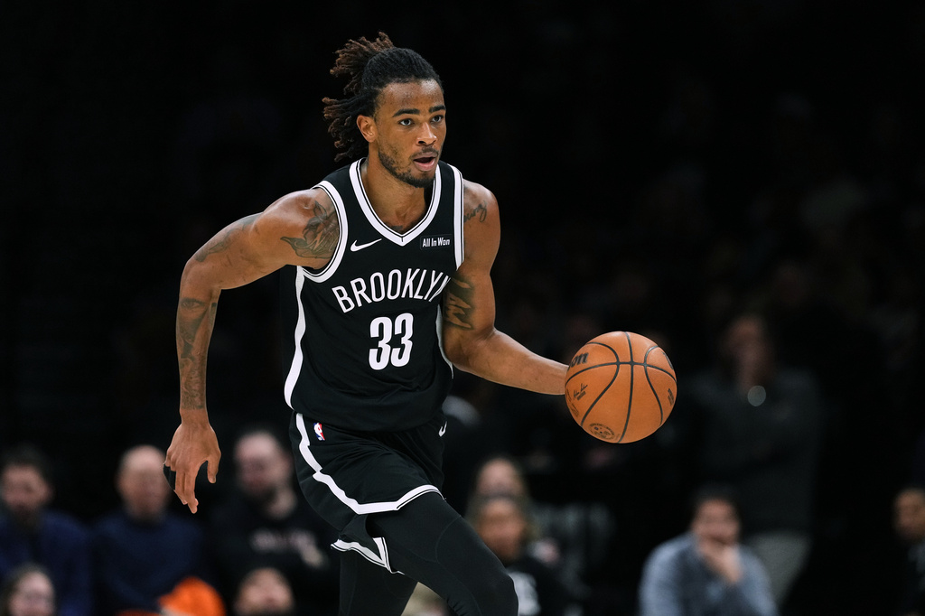 Brooklyn Nets' Nic Claxton (33) looks to pass during the second half of an NBA basketball game against the Sacramento Kings Sunday, March 29, 2026, in New York. (AP Photo/Frank Franklin II)
