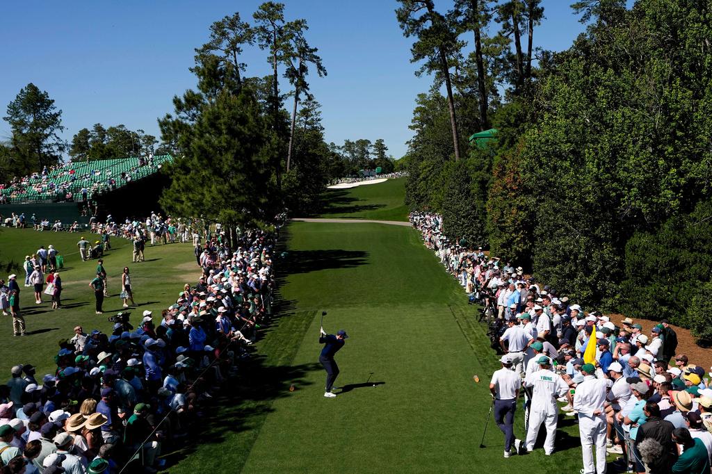 Rory McIlroy, of Northern Ireland, hits his tee shot on the 18th hole during the first round of the Masters golf tournament at the Augusta National Golf Club, Thursday, April 9, 2026, in Augusta, Ga. (AP Photo/David J. Phillip)