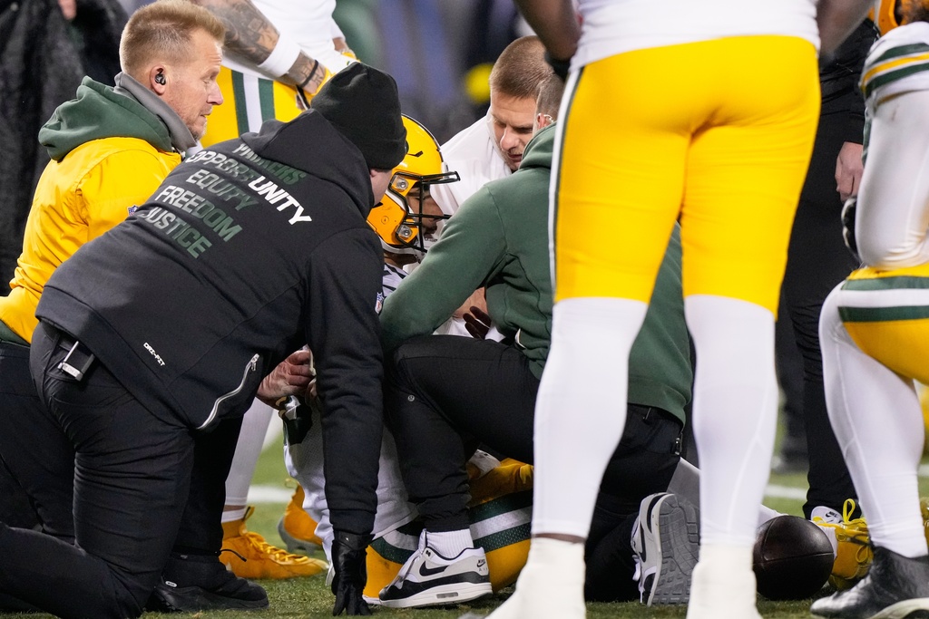 Green Bay Packers' Jordan Love is attended to after being hurt during the first half of an NFL football game against the Chicago Bears Saturday, Dec. 20, 2025, in Chicago. (AP Photo/Nam Huh)