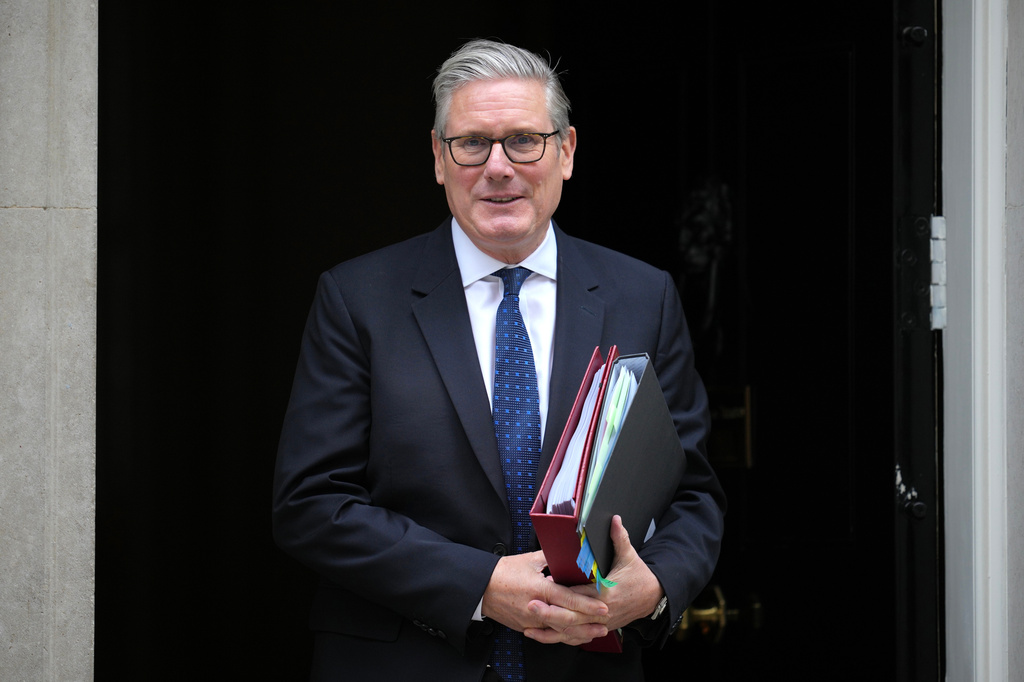 Britain's Prime Minister Keir Starmer leaves 10 Downing Street to attend the weekly session of Prime Minister's Questions in parliament in London, Wednesday, June 10, 2026. (AP Photo/Kin Cheung)