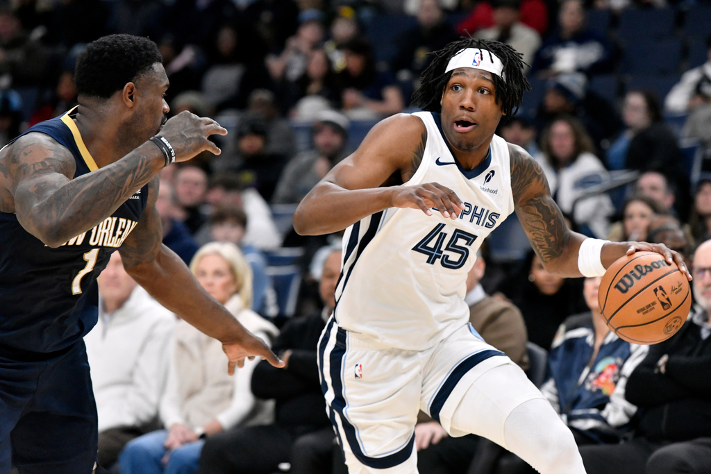 Memphis Grizzlies forward GG Jackson II (45) handles the ball against New Orleans Pelicans forward Zion Williamson (1) in the first half of an NBA basketball game Friday, Jan. 23, 2026, in Memphis, Tenn. (AP Photo/Brandon Dill)