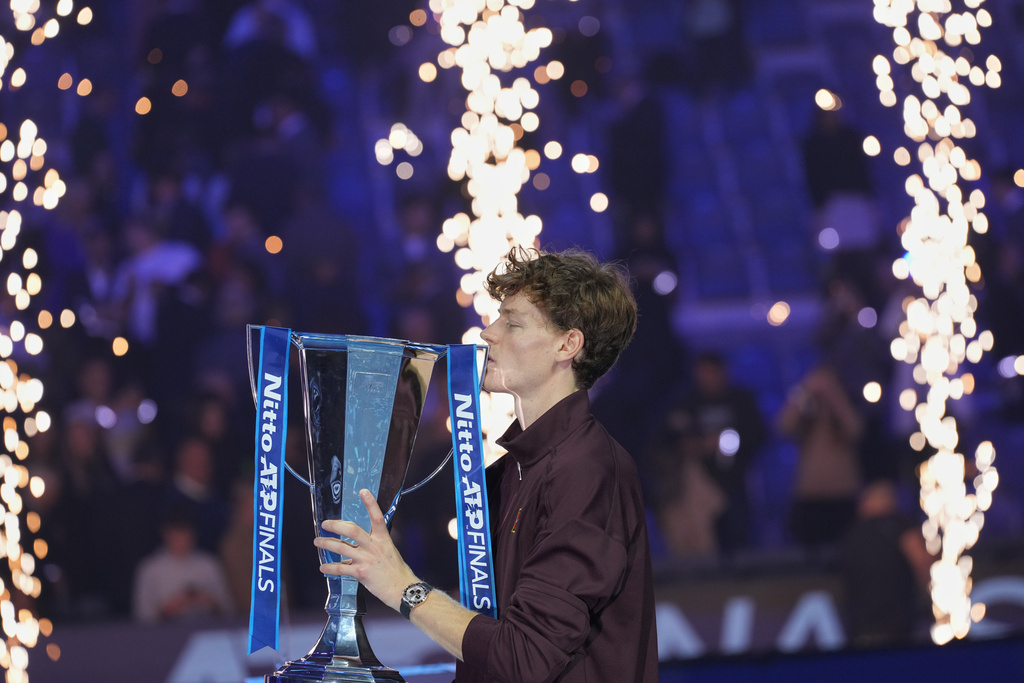 Italy's Jannik Sinner holds the trophy after winning the final tennis match of the ATP World Tour Finals against Spain's Carlos Alcaraz in Turin, Italy, Sunday, Nov. 16, 2025. (AP Photo/Antonio Calanni)