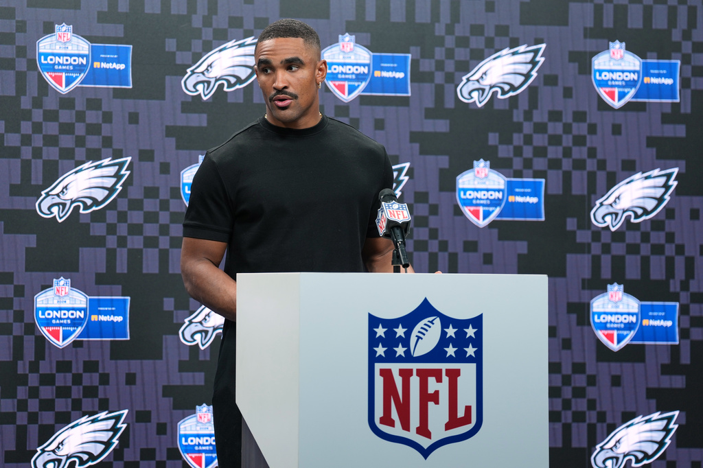 Philadelphia Eagles quarterback Jalen Hurts (1) attends a press conference after an NFL football game against Jacksonville Jaguars in London, Sunday, Oct. 11, 2026. (AP Photo/Alastair Grant)