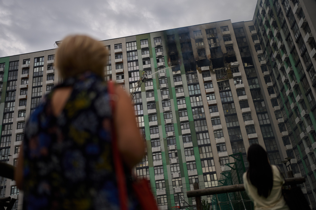 Firefighters work after a Russian drone attack struck a residential building in Kyiv, Tuesday, Sept. 1, 2026. (AP Photo/Francisco Seco)