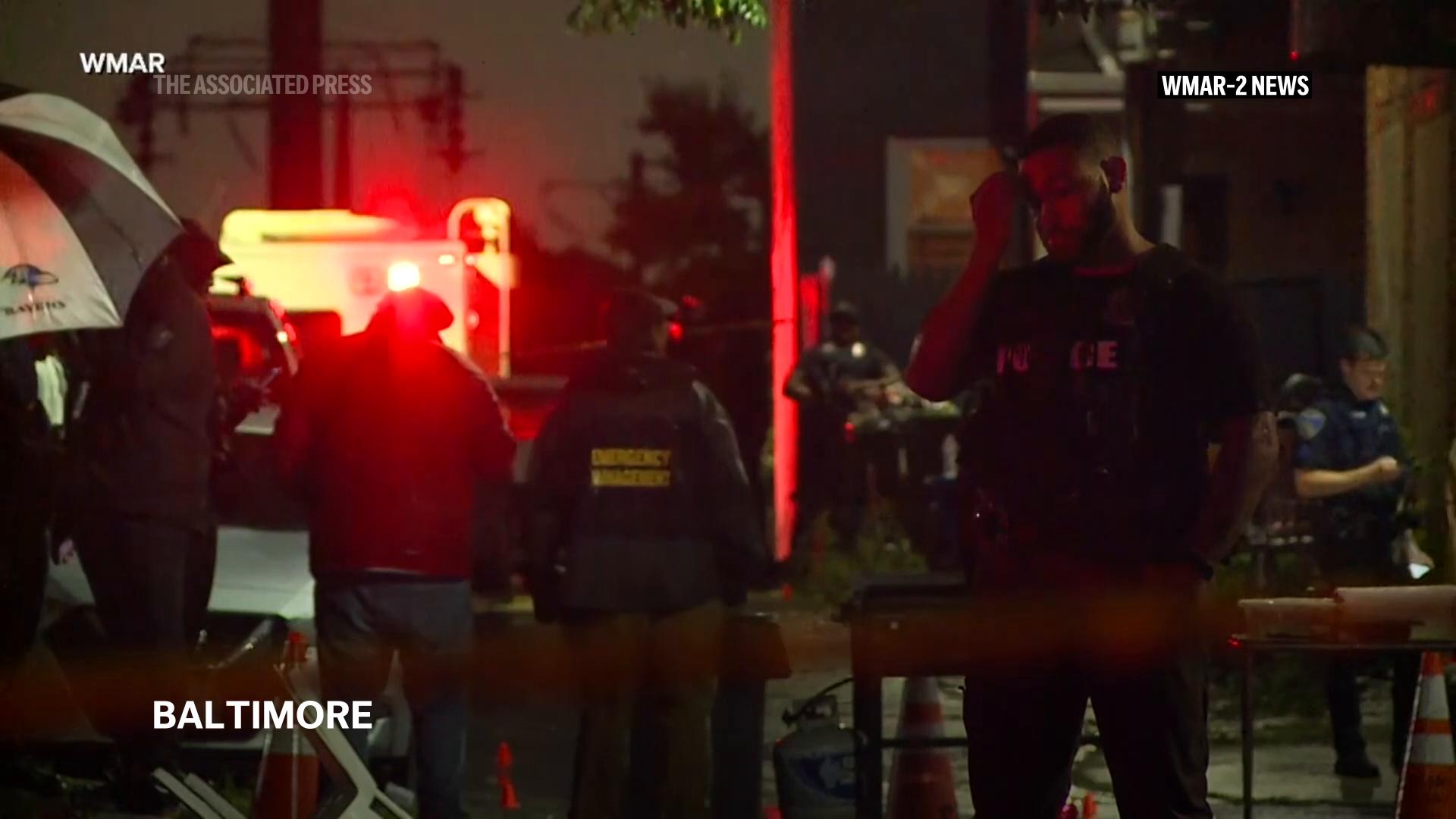 A shooting at a gathering in Baltimore leaves one person dead and seven others wounded, police said