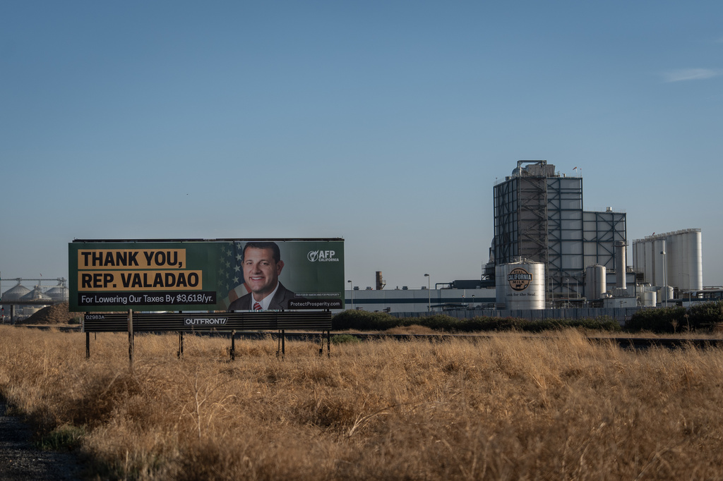 A billboard thanking U.S. Rep. David Valadao, R-Calif., stands near a dairy facility in Pixley, Calif., Friday, Aug. 21, 2026. (AP Photo/Jae C. Hong)