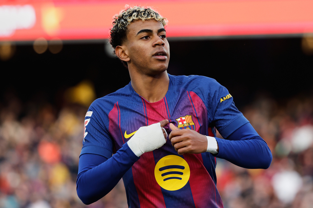 Barcelona's Lamine Yamal celebrates after scoring his side's first goal during a Spanish La Liga soccer match between Barcelona and Alaves, in Barcelona, Spain, Saturday, Nov. 29, 2025. (AP Photo/Joan Monfort)