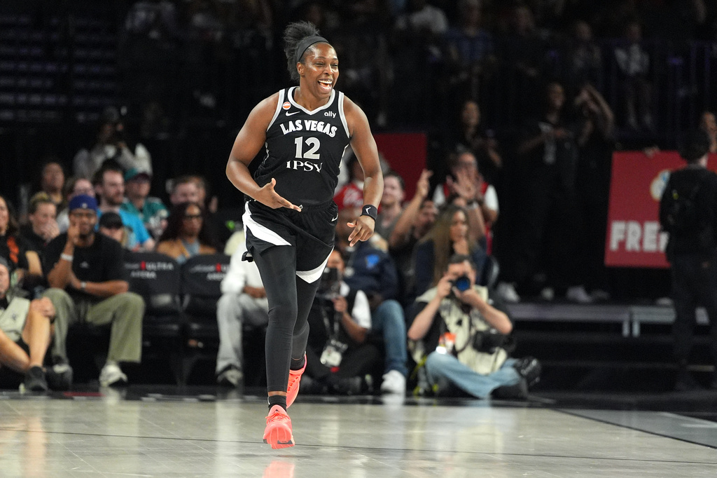 Las Vegas Aces guard Chelsea Gray (12) celebrates after scoring against the Seattle Storm during the second half of a WNBA basketball game Sunday, Sept. 20, 2026, in Las Vegas. (AP Photo/John Locher)