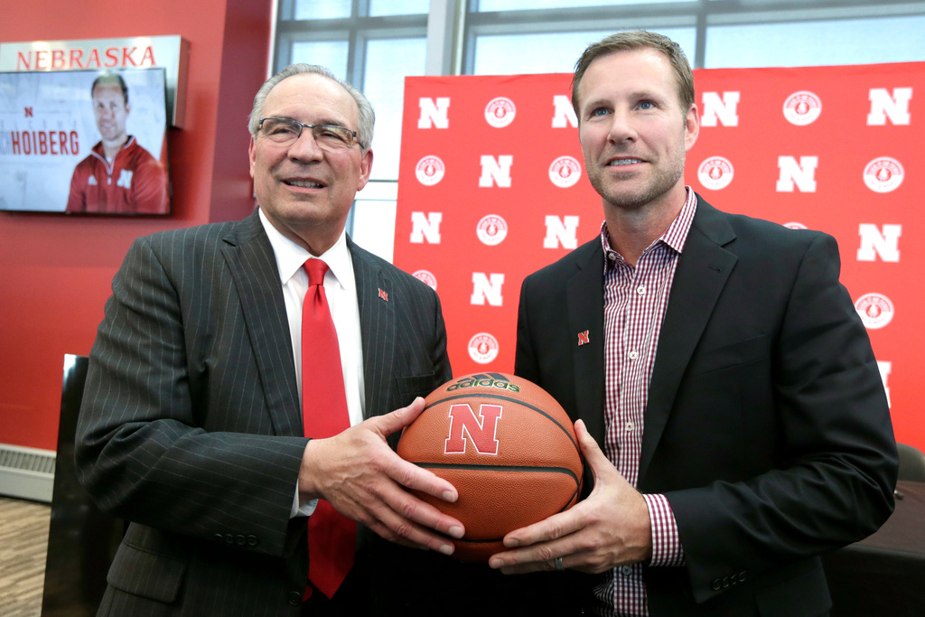 FILE - Fred Hoiberg, right, poses for a photo with Athletic Director Bill Moos, after he was introduced as Nebraska's new NCAA college basketball head coach at a news conference April 2, 2019, in Lincoln, Neb. (AP Photo/Nati Harnik, File)